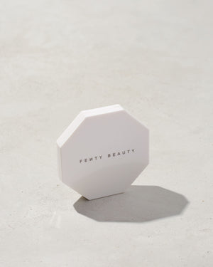 imagery of the white outside packaging imagery of killawatt freestyle highlighter in shade lightning dust/fire crystal on a concrete background