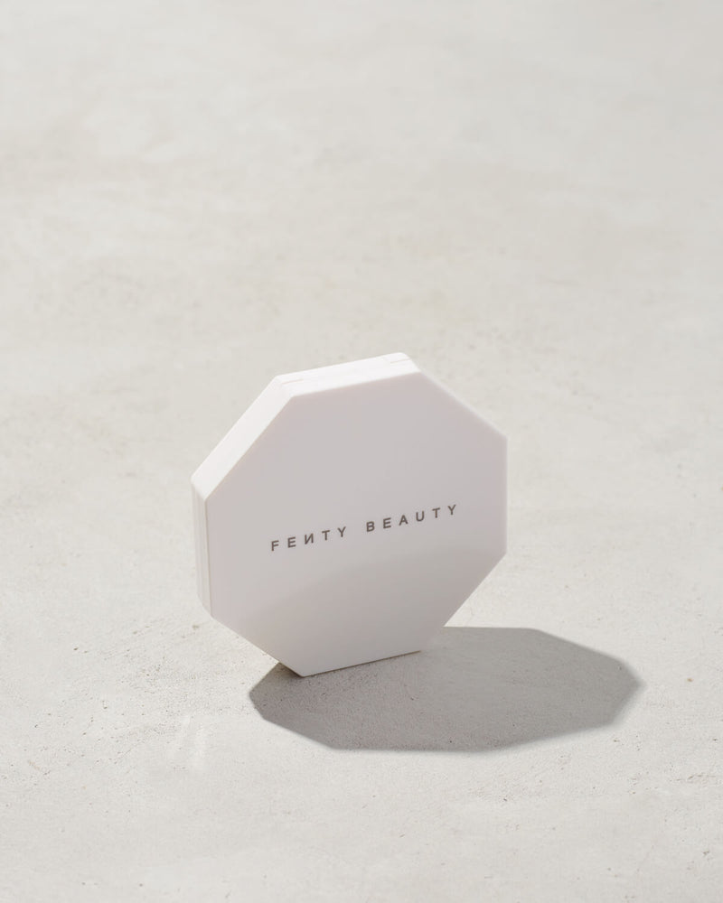 imagery of the white outside packaging imagery of killawatt freestyle highlighter in shade lightning dust/fire crystal on a concrete background